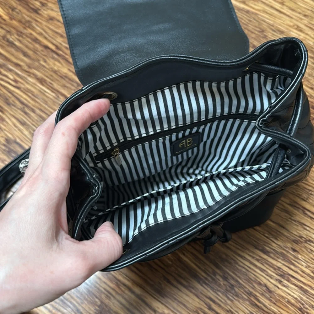 Alexis Bendel black quilted vegan leather adjustable backpack
